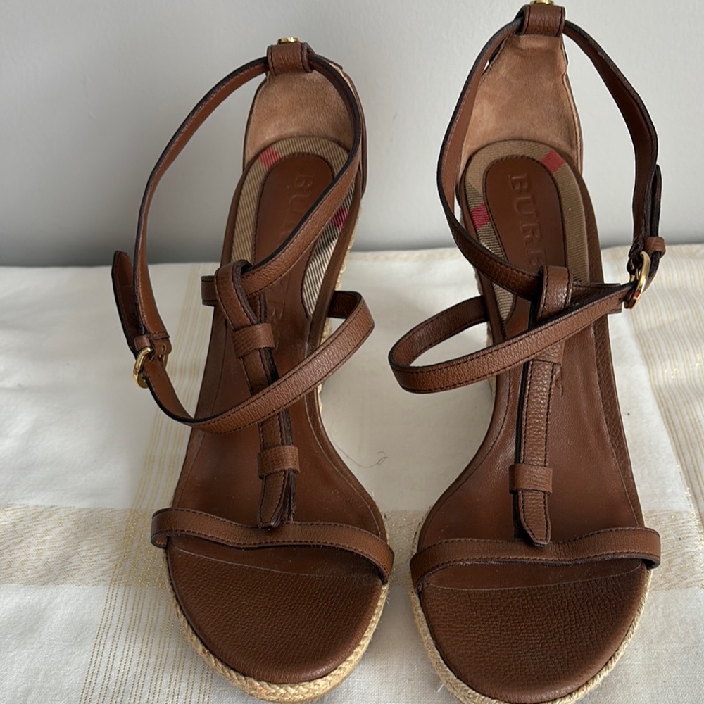 Designer Burberry sandals, strap around ankle and logo pattern on back. Size 10